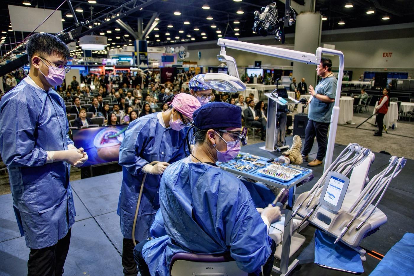Live surgical dentistry demonstration at a dental conference
